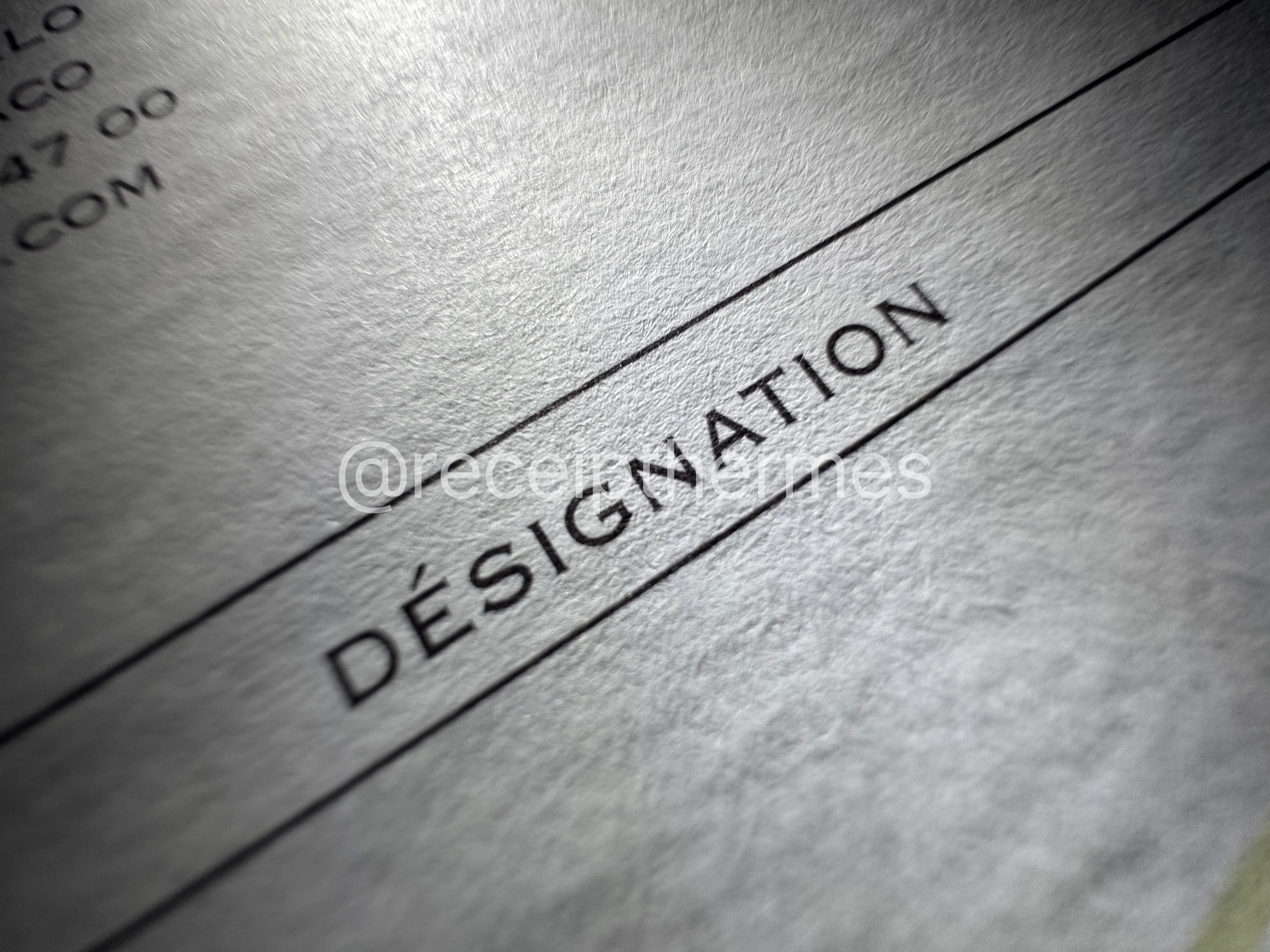 Replacement Hermes receipt closeup — DÉSIGNATION column header showing precise typography and line work