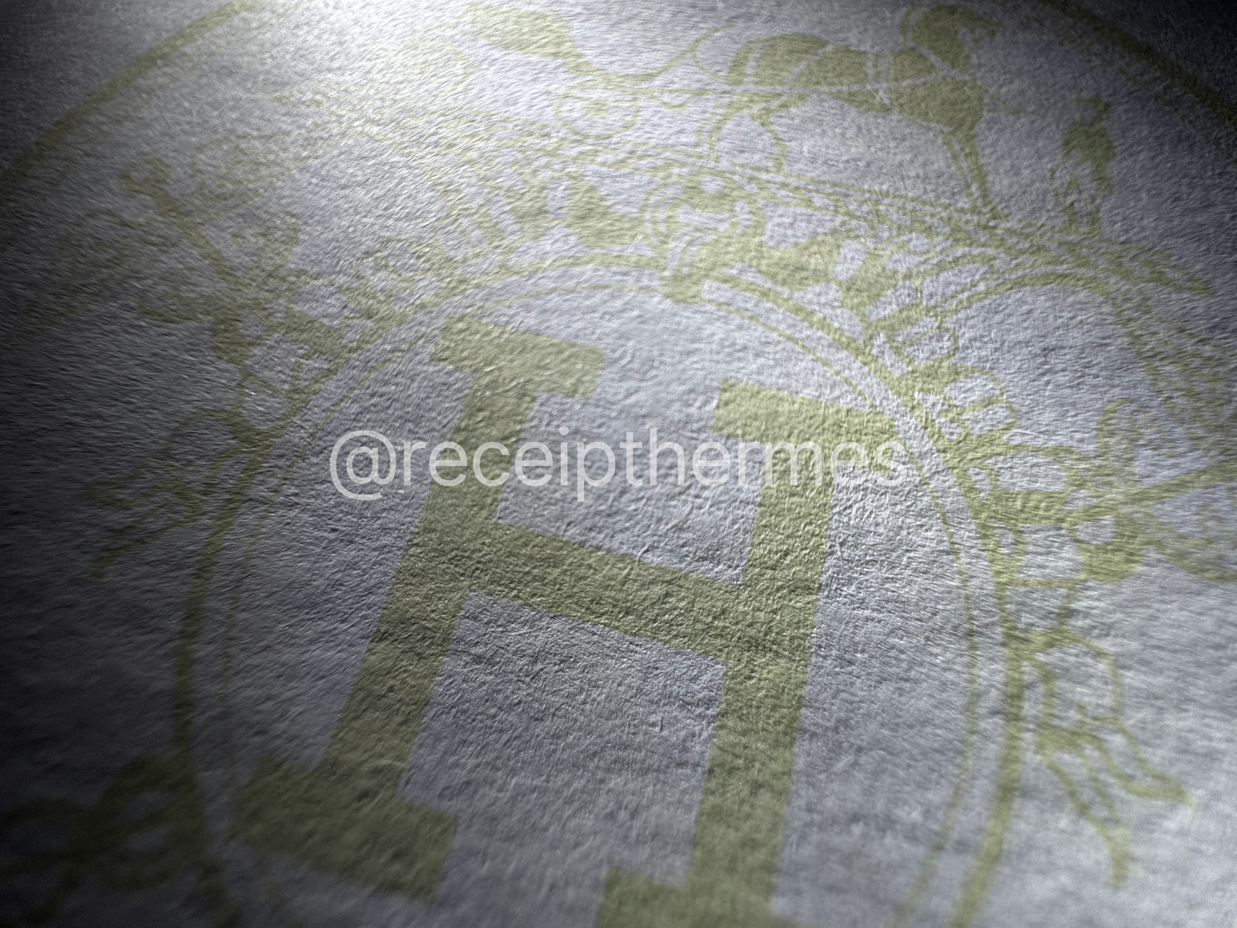 Replacement Hermes receipt closeup — pantone watermark showing Hermès carriage logo printed in brand-accurate color